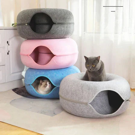 Plush donut-shaped cat bed that gives your kitty cozy, calming, all-day comfort.